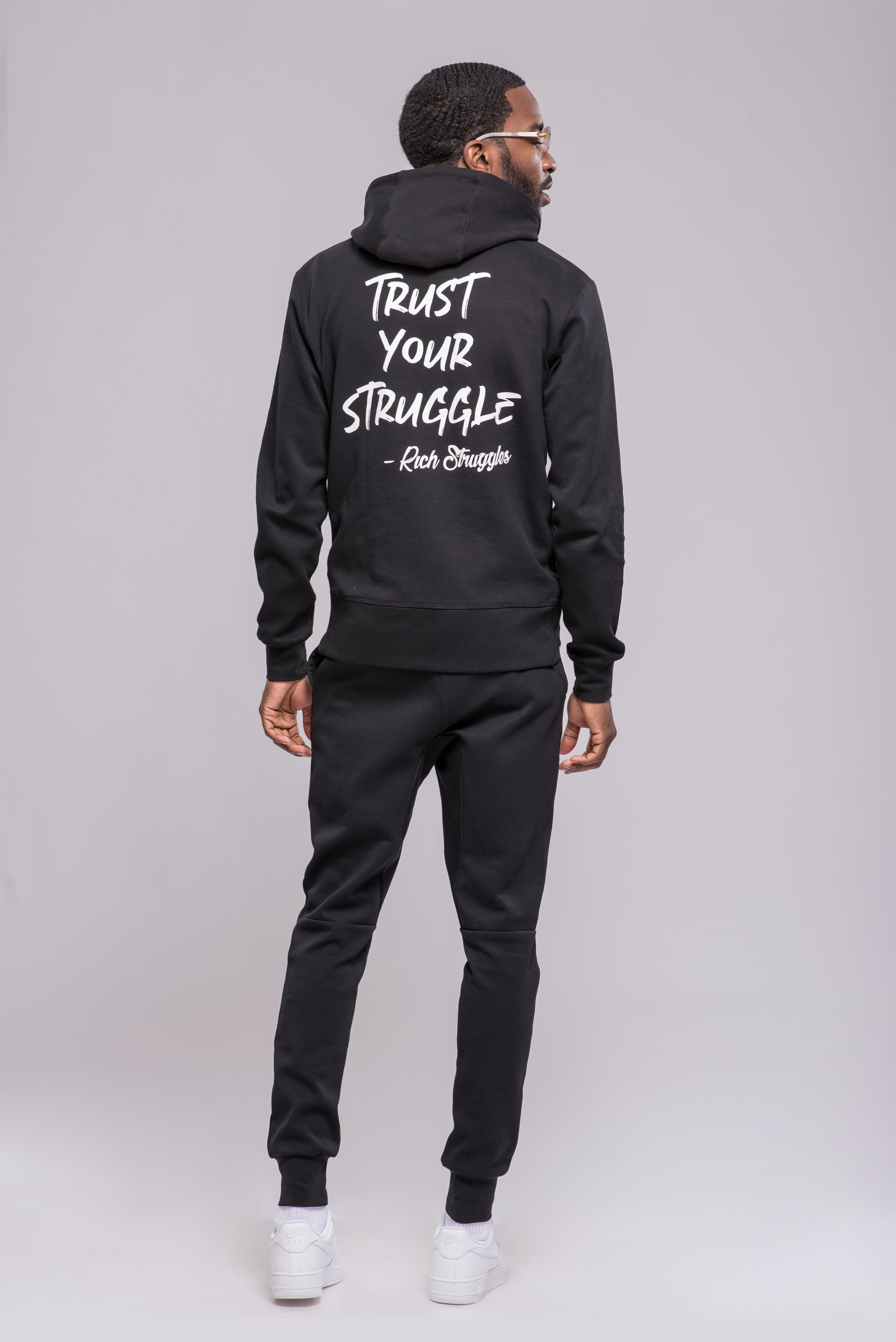 purple and black jogging suit